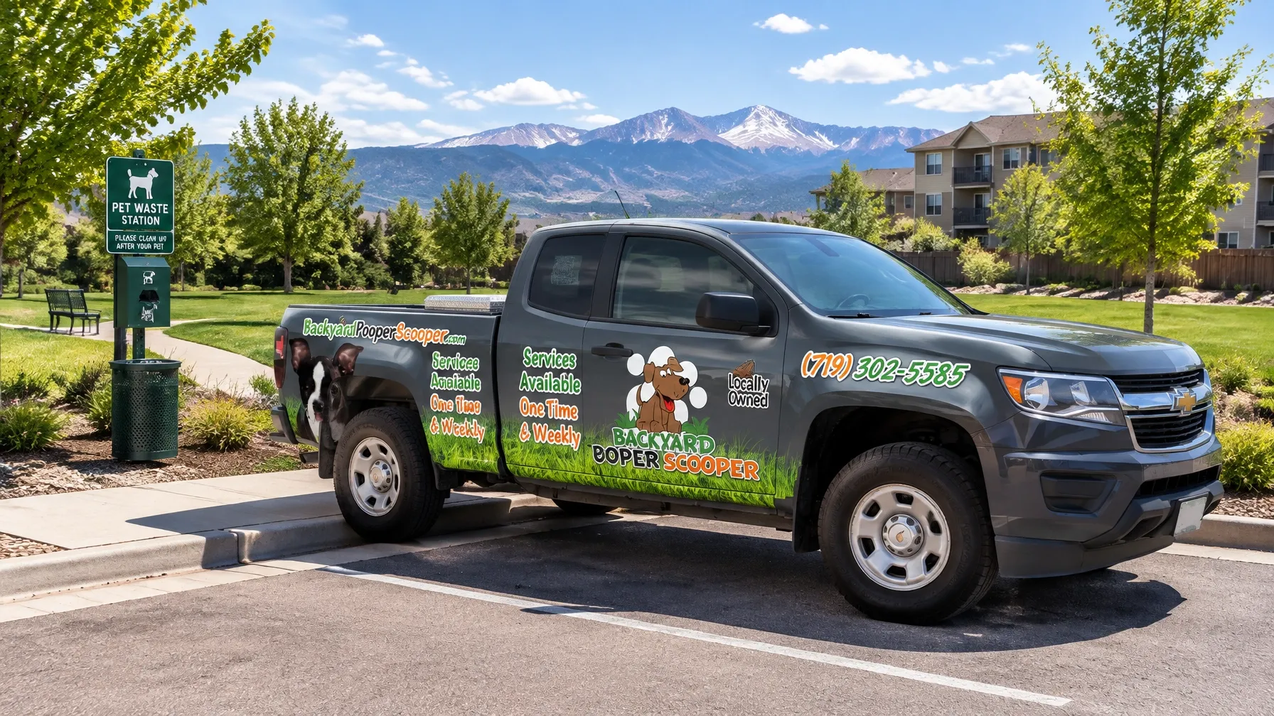 Backyard Pooper Scooper darker real fleet truck outside a Colorado Springs community green space with pet waste station