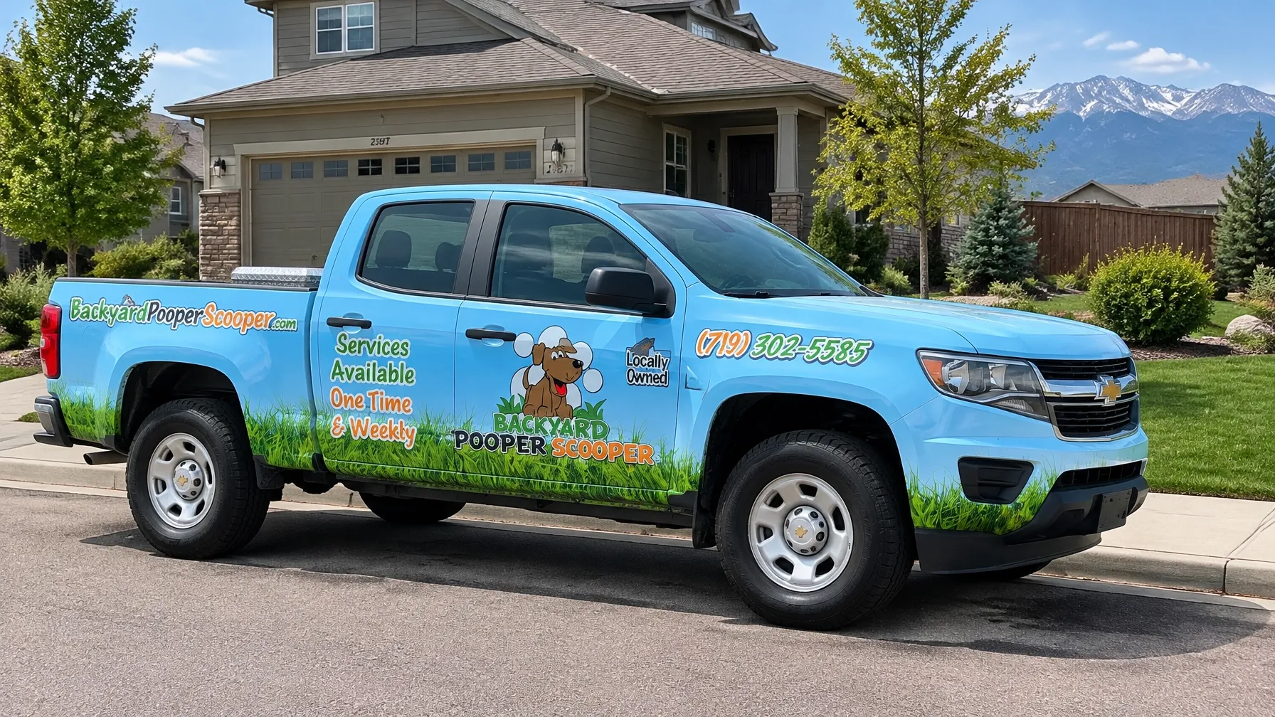 Backyard Pooper Scooper branded light blue Chevrolet fleet truck parked outside a neat Colorado Springs neighborhood property