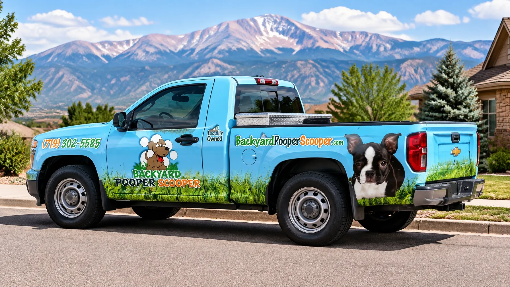 Backyard Pooper Scooper Boston terrier tailgate truck parked on a Colorado Springs residential street